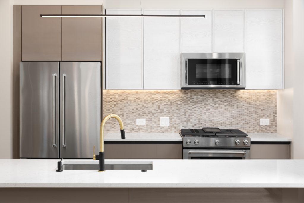 A kitchen featuring aluminium cabinets